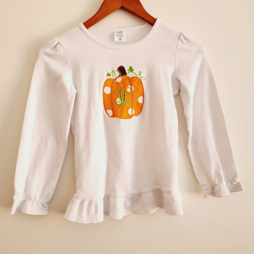 Long sleeve pumpkin tee H embroidered on front. Tags list 10 but fits 8-10